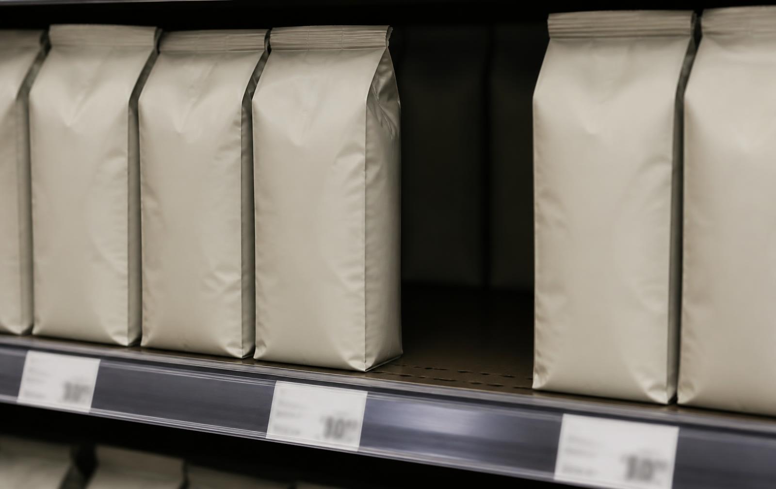 Close-up of a shelf row with one empty gap